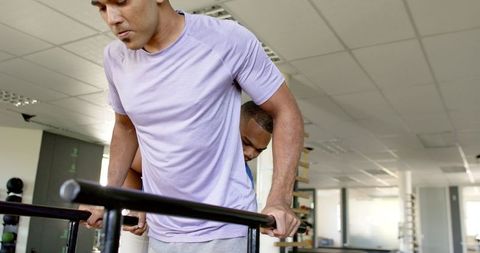 Man in Rehabilitation with Therapist in Gym Using Parallel Bars - Download Free Stock Images Pikwizard.com