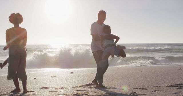 Family Enjoying Quality Time at Beach During Sunset - Download Free Stock Images Pikwizard.com