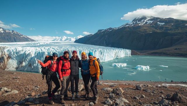 Five hikers exploring turquoise glacier lake during alpine trek with backpacks
