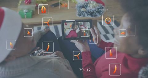 Holding tablet viewing augmented reality holiday overlays, cozy family wearing santa hats