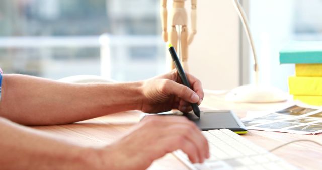 Designer Using Graphics Tablet in Modern Workspace - Download Free Stock Images Pikwizard.com