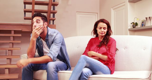 Frustrated Couple Arguing on Sofa in Modern Living Room - Download Free Stock Images Pikwizard.com