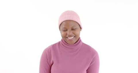 Woman in Pink Beanie Smiling for Casual Winter Fashion Portrait