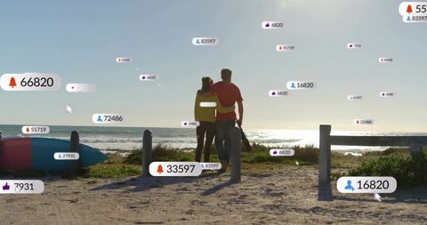 Couple embracing on beach path watching ocean with floating social media notification icons