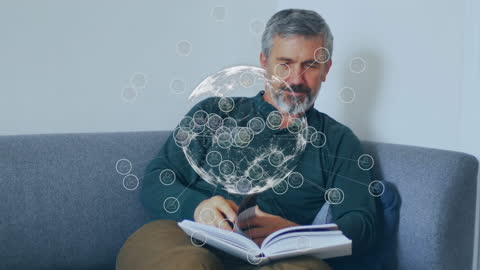 Senior Man Reading with Digital Global Network Overlay