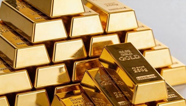Stacking 250g gold bars reflecting luxury and wealth, shiny bullion pile close-up