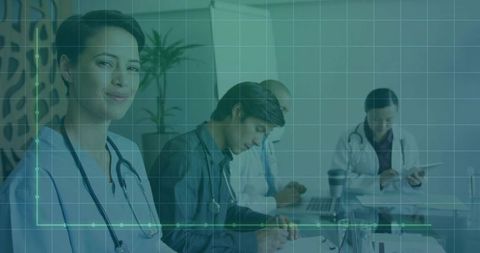 Medical team collaborating in conference room with graph overlay