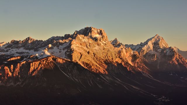 Sunset Illuminating Jagged Peaks of Mountain Range - Download Free Stock Photos Pikwizard.com