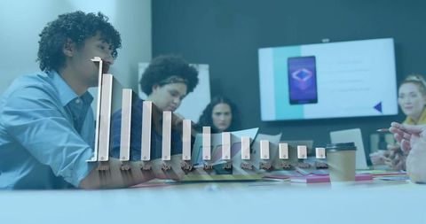 Diverse team collaborating on creative project in modern meeting room