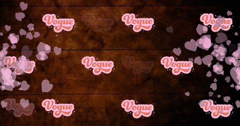 Vogue text and hearts on wooden background