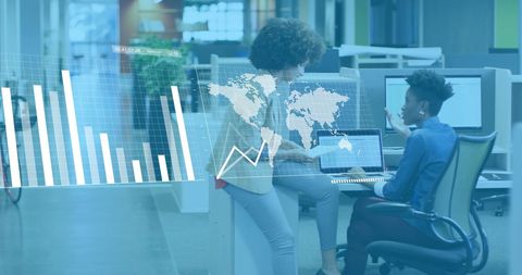 Diverse colleagues analyzing data with digital graphics