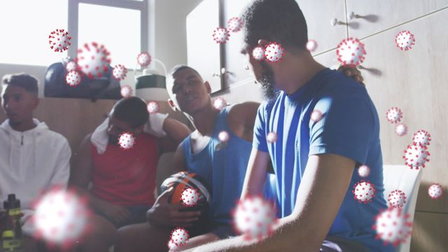 Video depicts a rugby team in a locker room setting with an overlay of virus cell animations to emphasize COVID-19 concerns. Suitable for illustrating the impact of the pandemic on sports, health safety measures in sports activities, and the importance of discussing health risks among athletes.