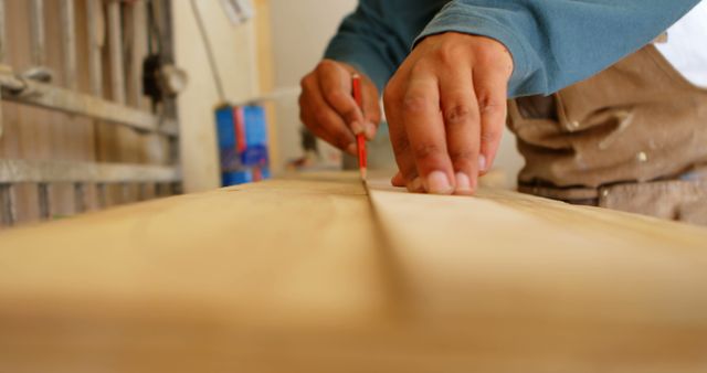 Carpenter Marking Wood Plank with Pencil in Workshop - Download Free Stock Images Pikwizard.com