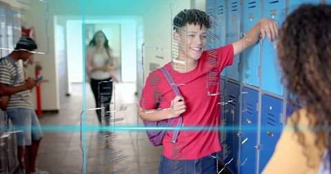 High school teen leaning at lockers smiling and chatting with friend wearing backpack