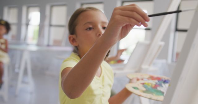 Young Girl Painting on Canvas in Art Classroom - Download Free Stock Images Pikwizard.com