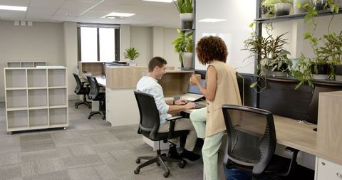 Professional Coworkers Collaborating in Modern Office Space