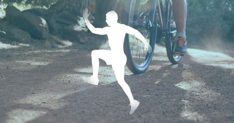 man silhouette overlaid on person cycling through a nature trail creates emphasis on outdoor activity and fitness. suitable for concepts involving modern technology use in fitness, and marketing for outdoor sports products.