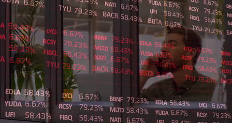 Analyst Monitoring Stock Market Data on Smart Device