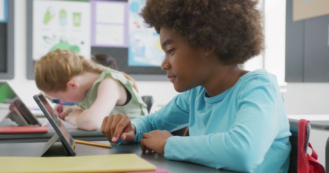 Focused Student Using Tablet in Classroom - Download Free Stock Images Pikwizard.com