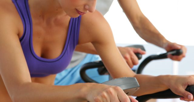 Women Exercising on Stationary Bikes at Gym - Download Free Stock Images Pikwizard.com