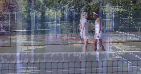 Two female tennis players exchanging focussed gazes during intense match