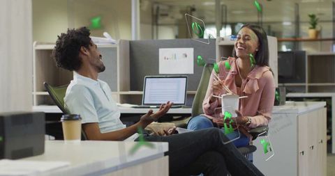 Diverse Coworkers Engaging in Relaxed Office Interaction