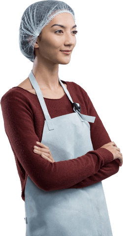 Thoughtful female chef standing wearing transparent hairnet