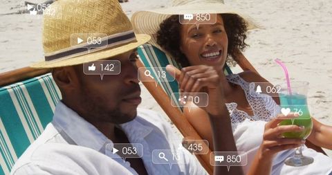 Relaxed Couple Enjoying Beach Vacation with Digital Overlay