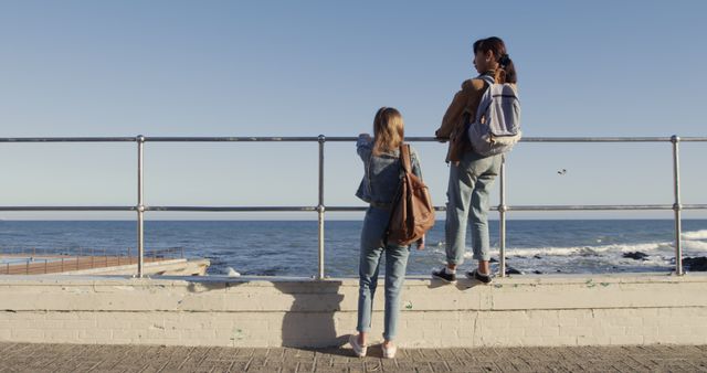 Girls Enjoying Ocean View from Seaside Promenade - Download Free Stock Images Pikwizard.com