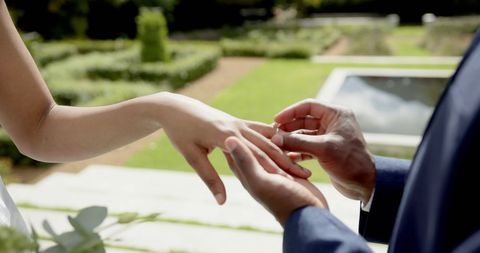 Exchange of Wedding Rings in Lush Garden Ceremony