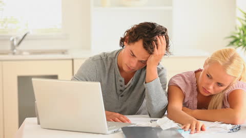 Couple Stressing Over Finances at Home