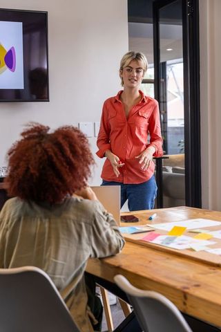 Diverse Team Collaborating on Project Strategy with Technology