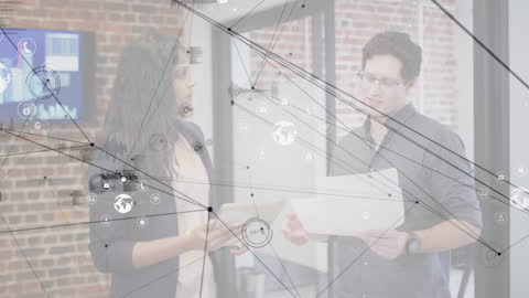 Business Professionals Analyzing Digital Data Interfaces