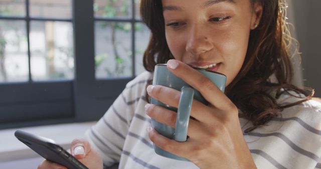 Woman Drinking Coffee and Using Smartphone at Home - Download Free Stock Images Pikwizard.com