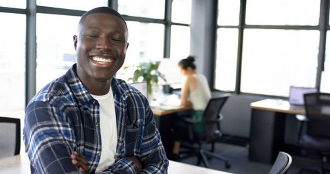 Smiling African American Businessman in Modern Office Setting - Download Free Stock Images Pikwizard.com