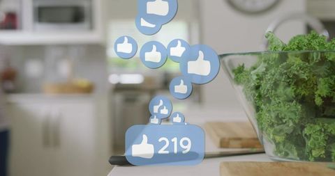 Floating social likes over fresh kale bowl on bright kitchen countertop for healthy eating
