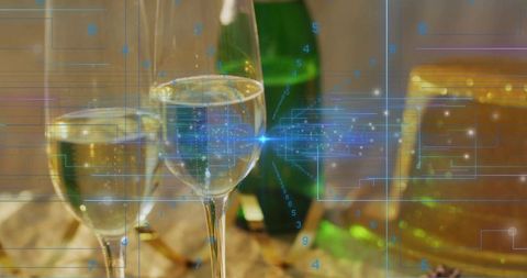 Champagne flutes catching light with futuristic hud overlay for luxury tech concept