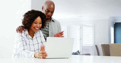 Happy Couple Sharing Laughter Exploring Laptop - Download Free Stock Images Pikwizard.com