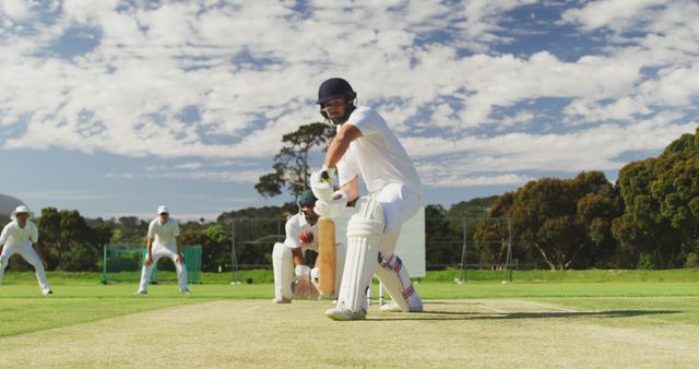 Cricket Player in Action on Sunny Day Field - Download Free Stock Images Pikwizard.com