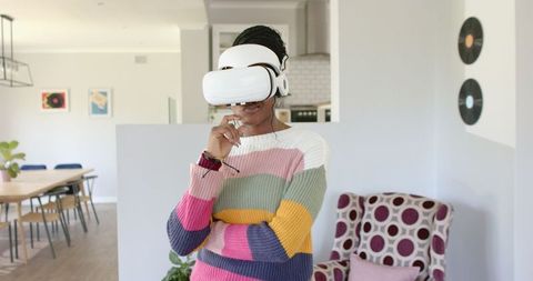 African woman immersed in virtual reality experience