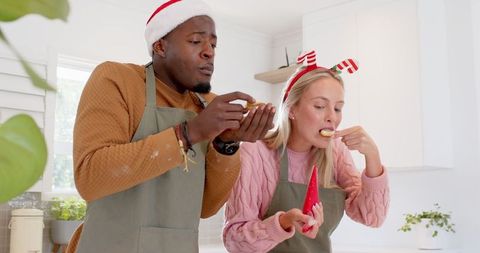 Festive Couple Enjoying Holiday Baking Together in Kitchen