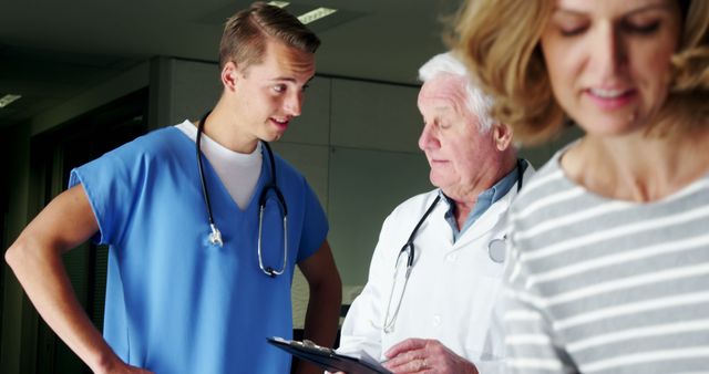 Young Medical Professional Consulting with Senior Doctor in Hospital - Download Free Stock Images Pikwizard.com