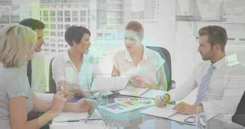 Diverse business team collaboration with data graphics overlay