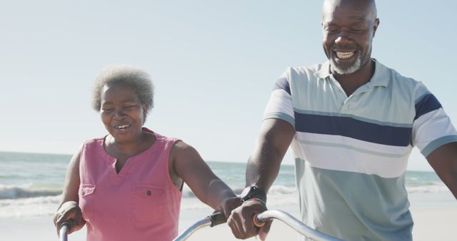 Senior African American Couple Enjoying Bike Ride on Beach - Download Free Stock Images Pikwizard.com