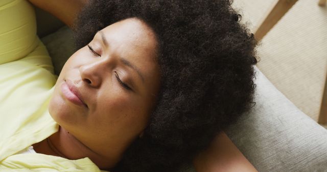 Relaxing Afro-American Woman Resting on Sofa at Home - Download Free Stock Images Pikwizard.com