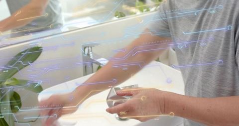Mature man holding and examining razor over modern sink with ar digital circuit overlay