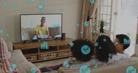 Family watching video call on smart tv with floating streaming icons for remote bonding