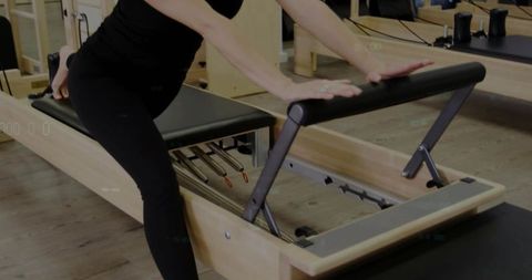 Kneeling pilates reformer footwork training for core strength and balance