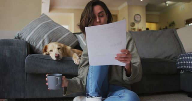 Woman Relaxing with Coffee and Document at Home - Download Free Stock Images Pikwizard.com