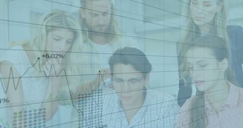 Diverse Colleagues Collaborating with Financial Data Overlay in Office